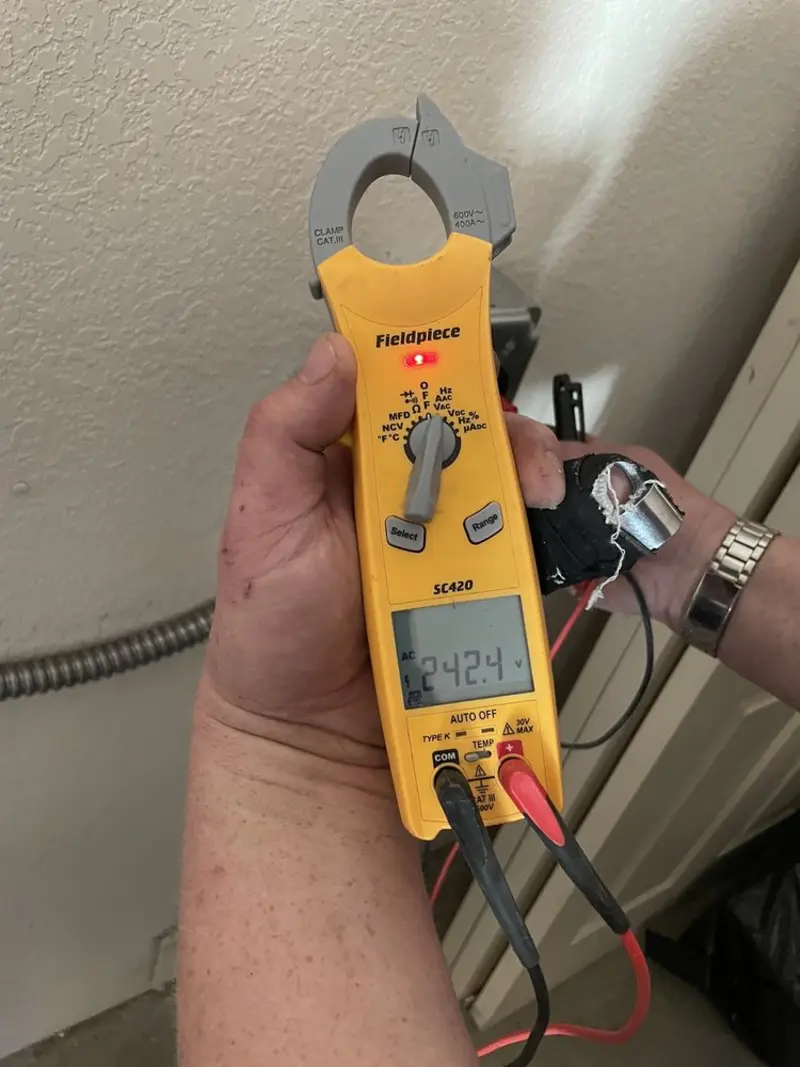 Voltage testing with clamp meter during Generator Installation in East Highland Park